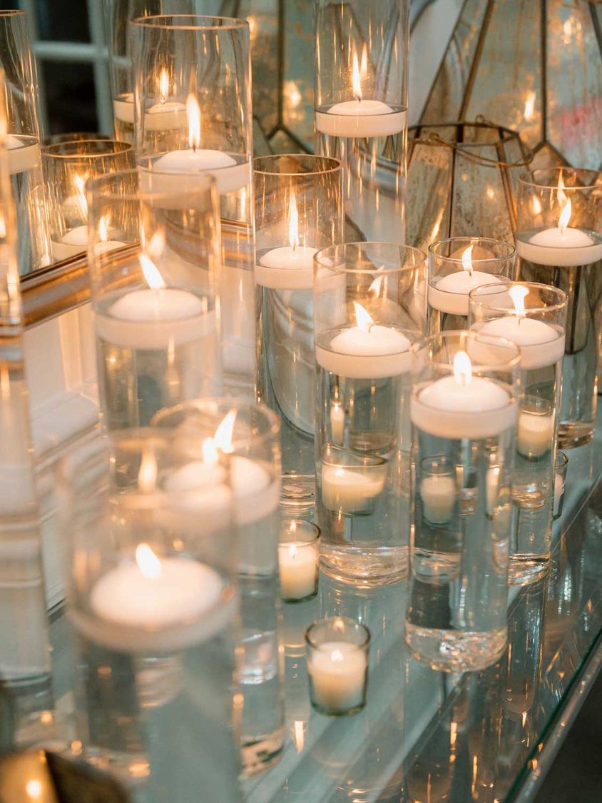 Floating candles in tall glass cylinders