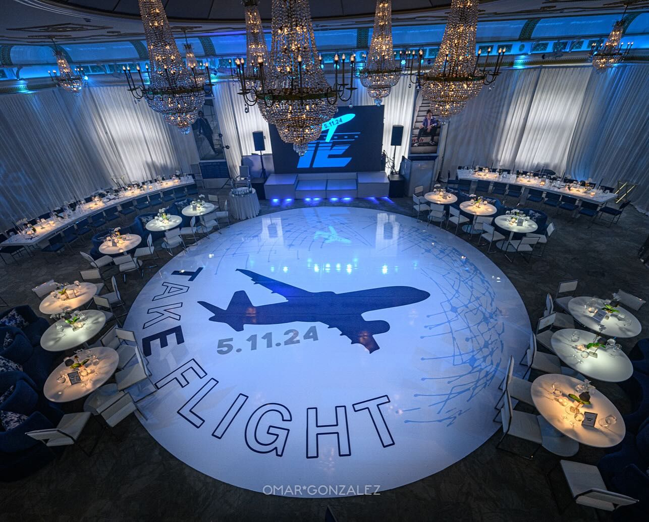 Bar mitzvah dance floor with an aviation theme and the words Take Flight