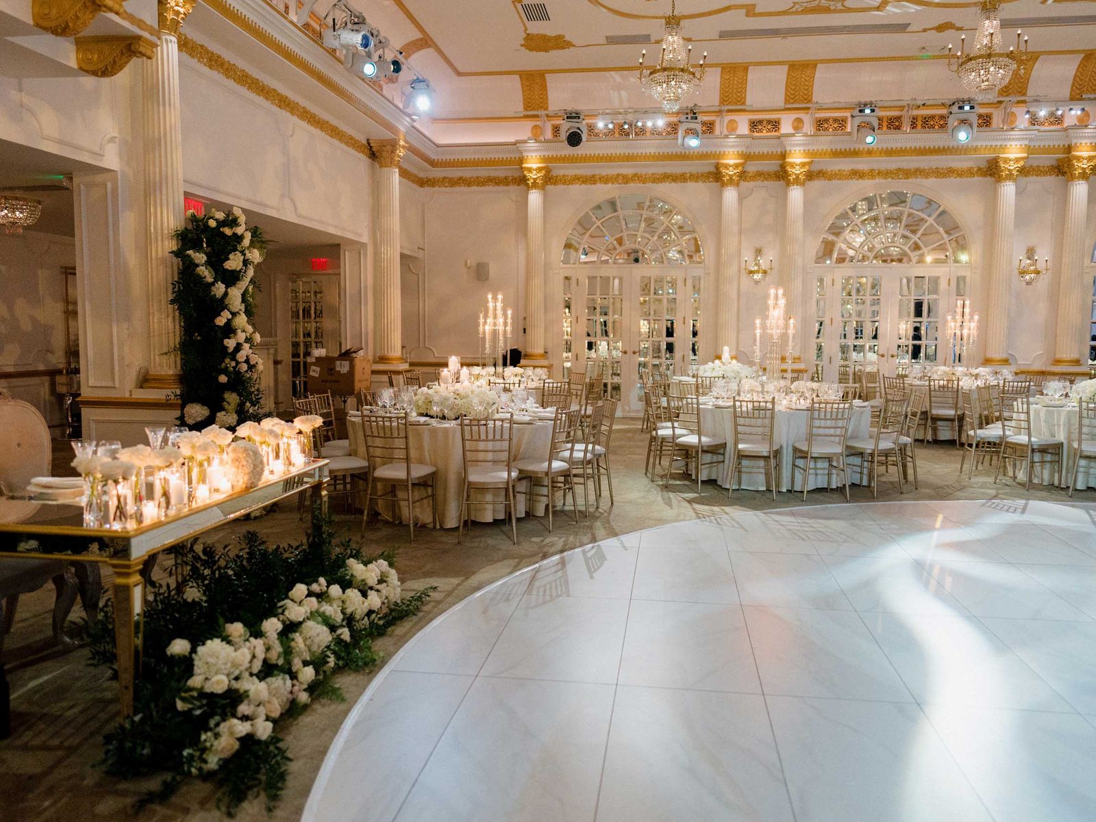Reception at Crystal Plaza with candlelit tables beside the dance floor