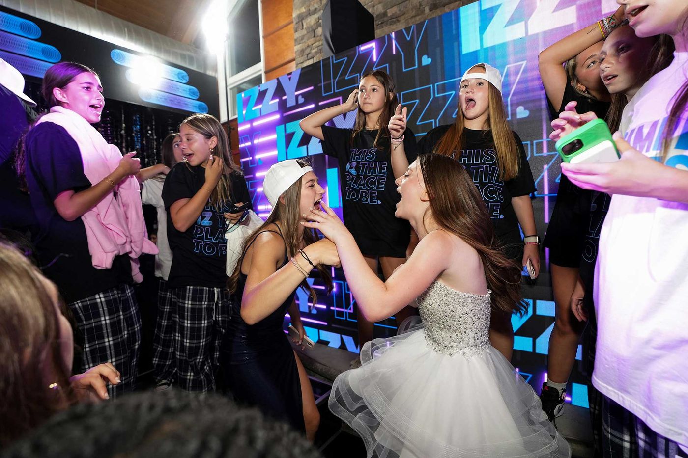 Bat mitzvah girl celebrating with her friends on the dance floor