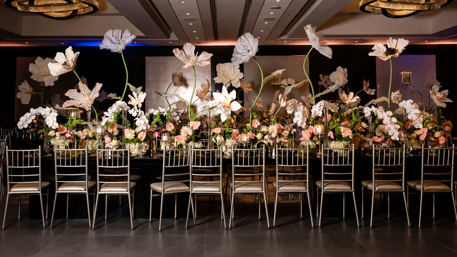 Sweet 16 dinner table with oversized white paper flowers