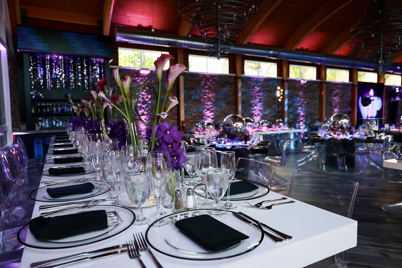White table setting with purple calla lilies
